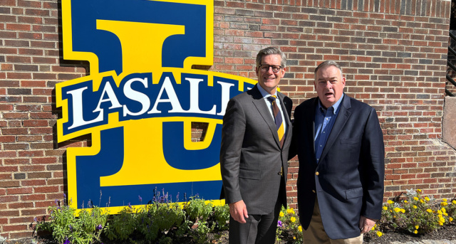 President Daniel J. Allen, Ph.D., thanked William M. Nolte, '70, Ph.D., after speaking with students in the Introduction to International Relations class about Nolte's long career as an intelligence officer on Oct. 3, 2023.