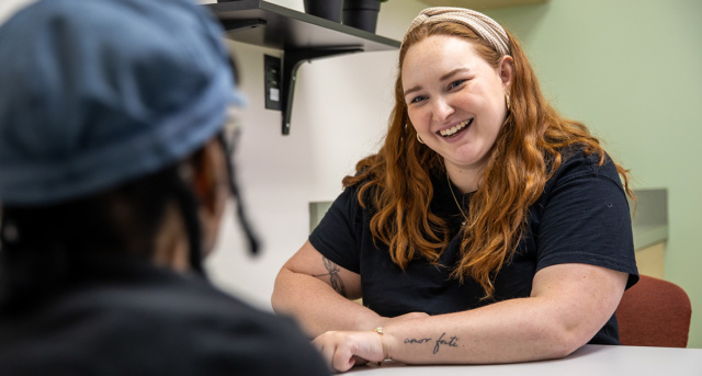 Communication Sciences and Disorders (CSD) student works with client in clinic