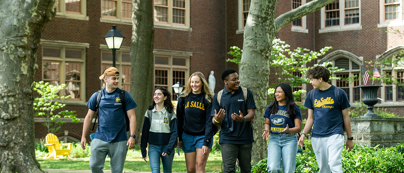 Image of students walking around the Hansen Quad.