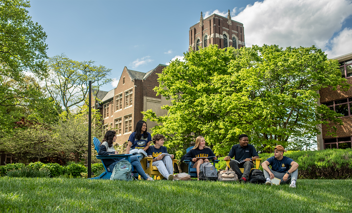 Image of students talking on the Hansen Quad.