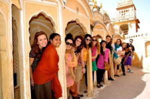 A group of students posing for a photo in an outdoor space. 