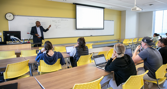 Image of students learning in a classroom.