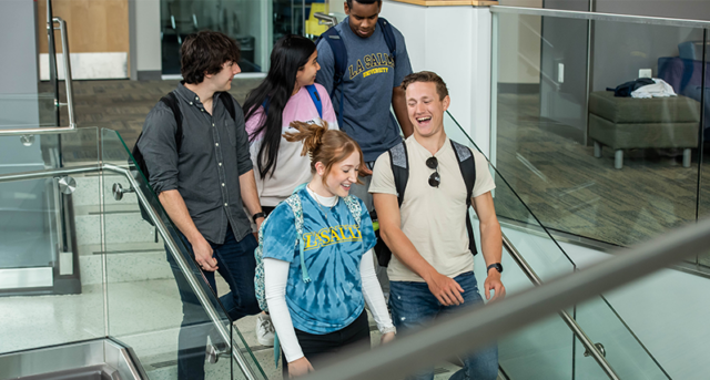 Image of students walking down stairs in Founders' Hall.