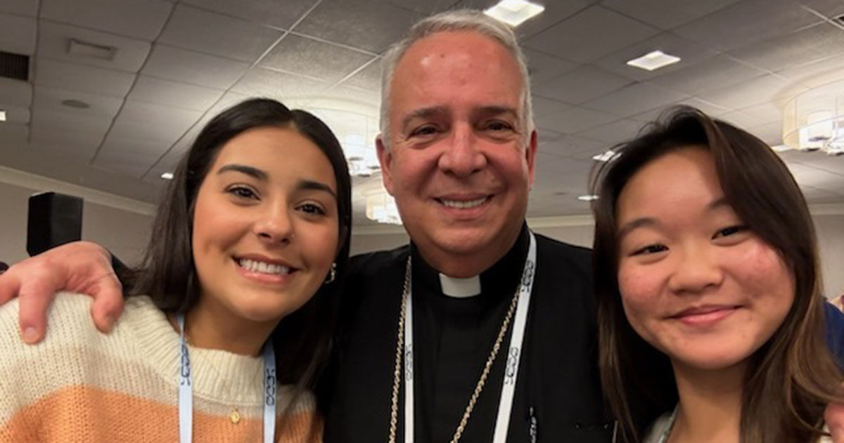 Abigail Griswold, '26, M.A. ‘27 (left) and Haylie Doan, ‘26, M.A. ‘27, met with Philadelphia Archbishop Nelson J. Pérez at SEEK25 in Washington, D.C.