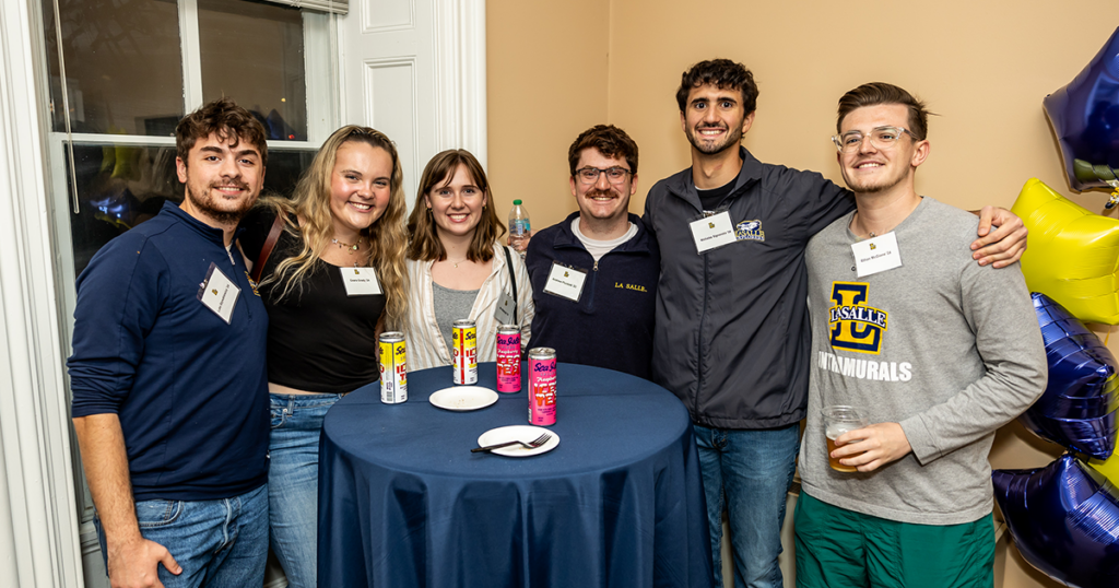 Image of 5 alumni at Homecoming