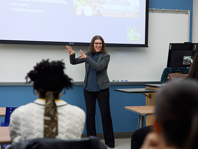 Image of a professor teaching a class.