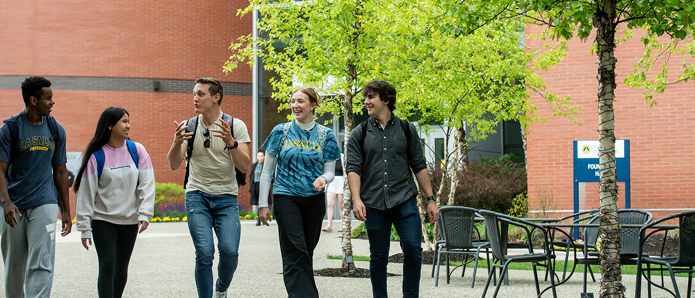 Image of students walking outside of Founders' Hall.