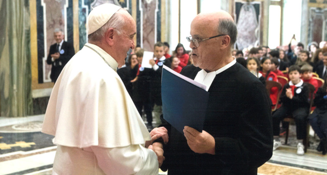 Br. Robert “Bob” Schieler, FSC, Ed.D., ’72, (right) greets Pope Francis at the Vatican during a ceremony to commemorate the 300th passing of Saint John Baptist De La Salle in 2019.